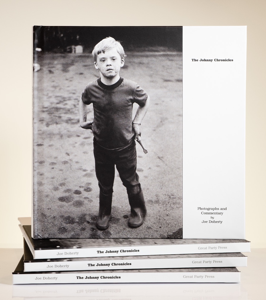 Stack of books: The Johnny Chronicles with young boy on the cover.